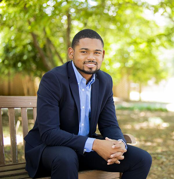 student on campus in business attire